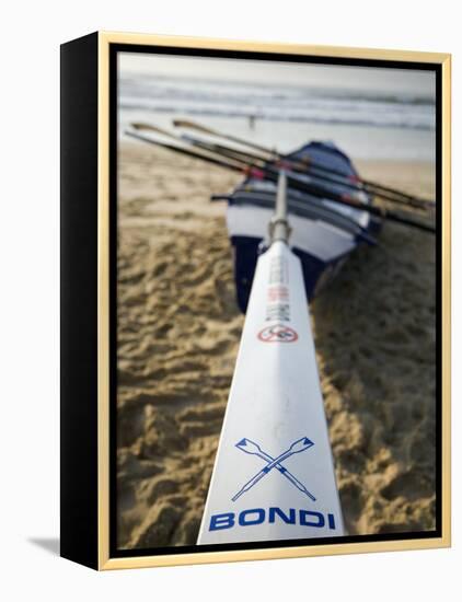 New South Wales, Sydney, A Surfboat Sits on Beach at Bondi in Sydney's Eastern Beaches, Australia-Andrew Watson-Framed Premier Image Canvas
