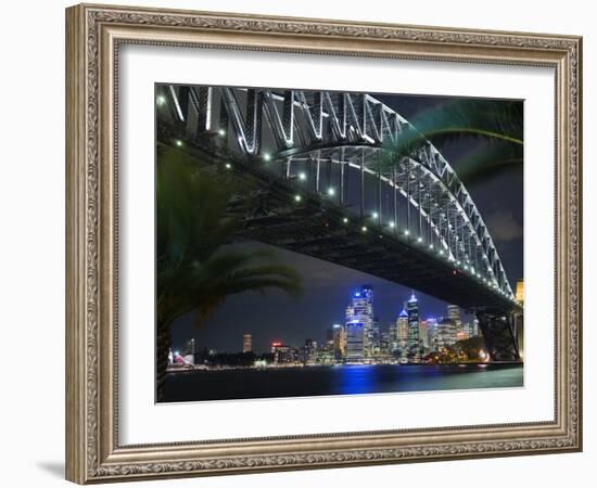 New South Wales, Sydney, Palm Trees Frame the Sydney Harbour Bridge and Skyline of Central Sydney, -Andrew Watson-Framed Photographic Print