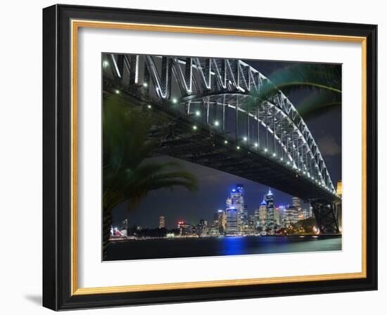 New South Wales, Sydney, Palm Trees Frame the Sydney Harbour Bridge and Skyline of Central Sydney, -Andrew Watson-Framed Photographic Print