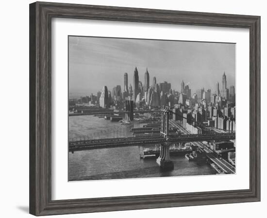 New York City Behind the Brooklyn and Manhattan Bridges That are Hovering over the East River-Dmitri Kessel-Framed Photographic Print