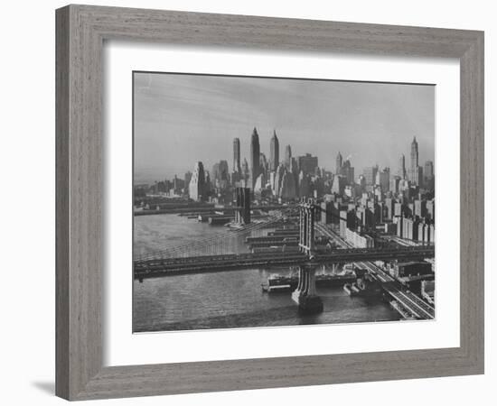 New York City Behind the Brooklyn and Manhattan Bridges That are Hovering over the East River-Dmitri Kessel-Framed Photographic Print