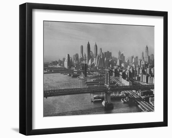 New York City Behind the Brooklyn and Manhattan Bridges That are Hovering over the East River-Dmitri Kessel-Framed Photographic Print