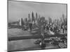 New York City Behind the Brooklyn and Manhattan Bridges That are Hovering over the East River-Dmitri Kessel-Mounted Photographic Print