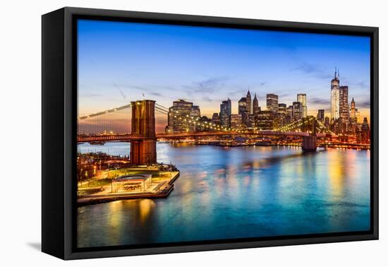 New York City, USA Skyline over East River and Brooklyn Bridge.-Sean Pavone-Framed Premier Image Canvas