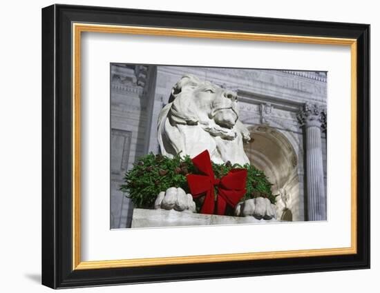 New York Public Library Lion Decorated with a Christmas Wreath during the Holidays.-Jon Hicks-Framed Photographic Print