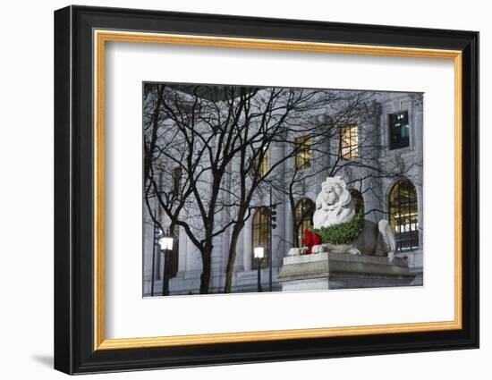 New York Public Library Lion Decorated with a Christmas Wreath during the Holidays.-Jon Hicks-Framed Photographic Print