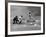 New York Yankee Joe Di Maggio Swinging Bat in Game Against the Philadelphia Athletics-Alfred Eisenstaedt-Framed Premium Photographic Print