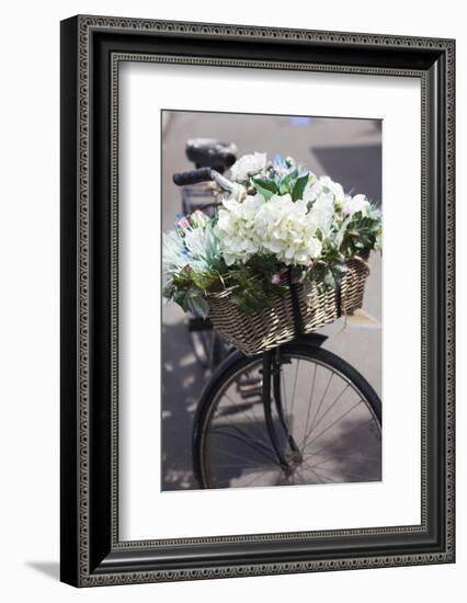 New Zealand, North Island, Martinborough. Bicycle with flowers-Walter Bibikow-Framed Photographic Print