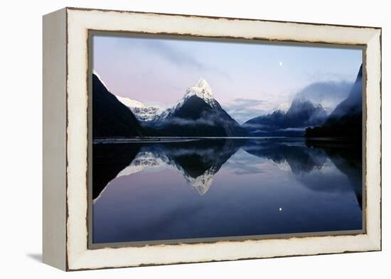 New Zealand, Nuova Zelanda, Fiordland, Milford Sound and Moon During a Cold and Misty Sunrise.-Andrea Pozzi-Framed Premier Image Canvas