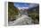 New Zealand, South Island, Fox Glacier Village, Fox Glacier hikers along Fox River-Walter Bibikow-Framed Premier Image Canvas