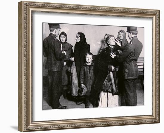 Newly Arrived Immigrants Undergoing Medical Examination on Ellis Island, New York, c.1910-null-Framed Photographic Print