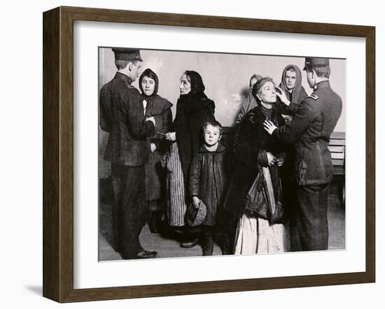 Newly Arrived Immigrants Undergoing Medical Examination on Ellis Island, New York, c.1910-null-Framed Photographic Print