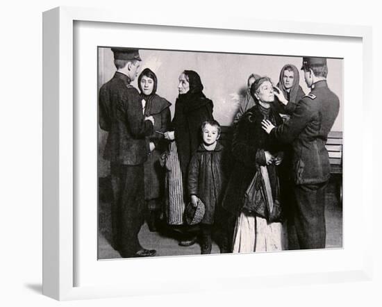 Newly Arrived Immigrants Undergoing Medical Examination on Ellis Island, New York, c.1910-null-Framed Photographic Print