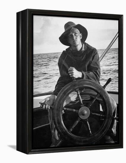 Newport Bermuda Sailing Race: Young Man Attending the Wheel of a Sailboat-Peter Stackpole-Framed Premier Image Canvas