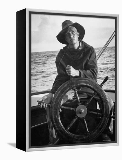 Newport Bermuda Sailing Race: Young Man Attending the Wheel of a Sailboat-Peter Stackpole-Framed Premier Image Canvas