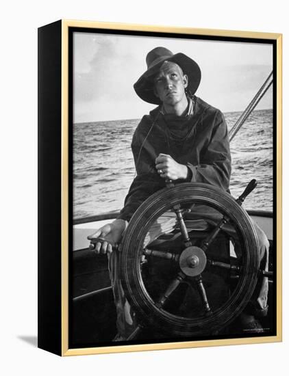 Newport Bermuda Sailing Race: Young Man Attending the Wheel of a Sailboat-Peter Stackpole-Framed Premier Image Canvas