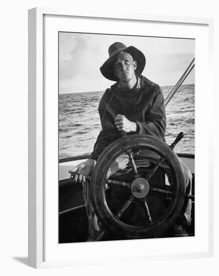 Newport Bermuda Sailing Race: Young Man Attending the Wheel of a Sailboat-Peter Stackpole-Framed Photographic Print