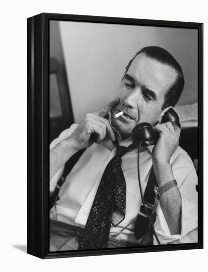 News Commentator, Edward R. Murrow with cigarette in mouth, tie loose, resting in his chair-Lisa Larsen-Framed Premier Image Canvas