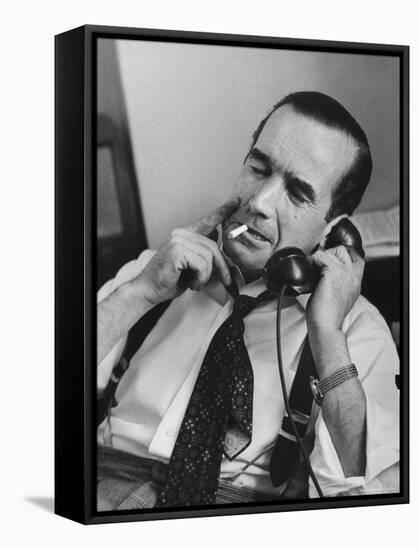 News Commentator, Edward R. Murrow with cigarette in mouth, tie loose, resting in his chair-Lisa Larsen-Framed Premier Image Canvas