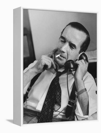 News Commentator, Edward R. Murrow with cigarette in mouth, tie loose, resting in his chair-Lisa Larsen-Framed Premier Image Canvas