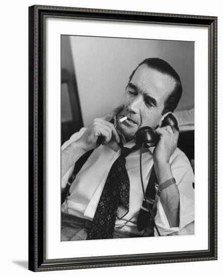 News Commentator, Edward R. Murrow with cigarette in mouth, tie loose, resting in his chair-Lisa Larsen-Framed Premium Photographic Print