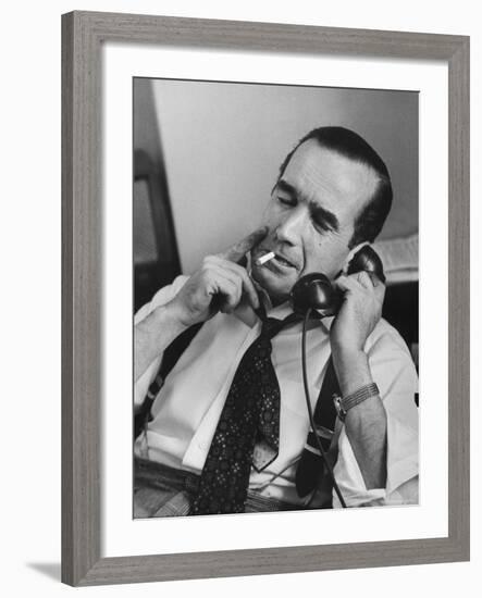 News Commentator, Edward R. Murrow with cigarette in mouth, tie loose, resting in his chair-Lisa Larsen-Framed Premium Photographic Print