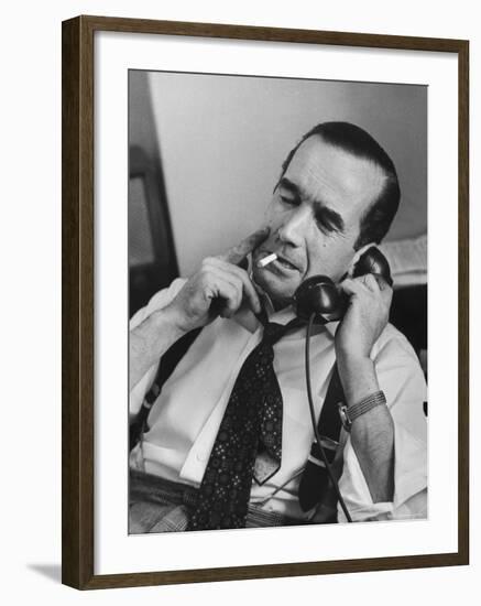 News Commentator, Edward R. Murrow with cigarette in mouth, tie loose, resting in his chair-Lisa Larsen-Framed Premium Photographic Print