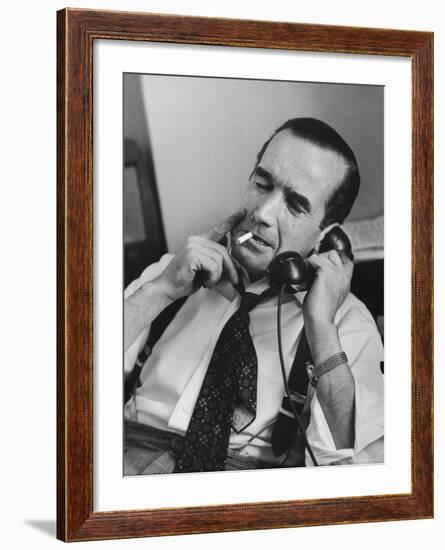 News Commentator, Edward R. Murrow with cigarette in mouth, tie loose, resting in his chair-Lisa Larsen-Framed Premium Photographic Print