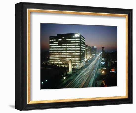 Night Photo of Car Light Trails and Traffic on Wiltshire Boulevard, Los Angeles, Califronia, 1959-Ralph Crane-Framed Photographic Print