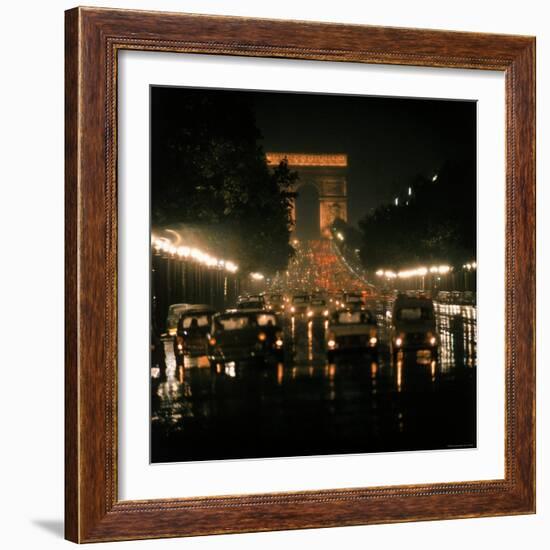 Night Time Traffic Streaming Down the Champs Elysees with the Arc de Triomphe in Background-Ralph Crane-Framed Photographic Print