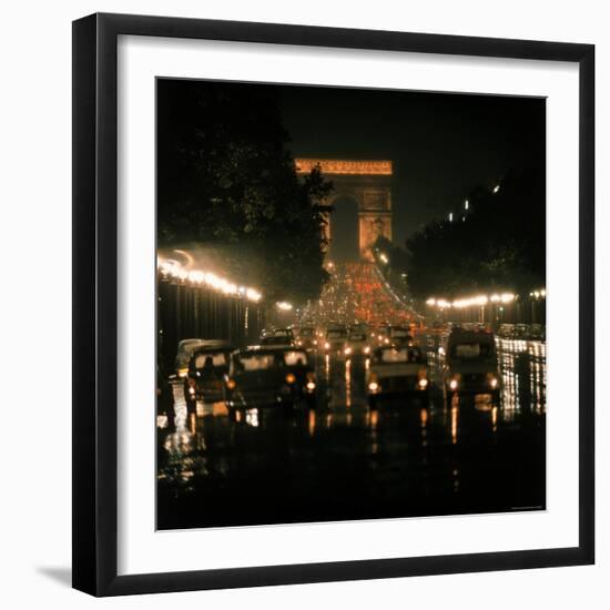 Night Time Traffic Streaming Down the Champs Elysees with the Arc de Triomphe in Background-Ralph Crane-Framed Photographic Print