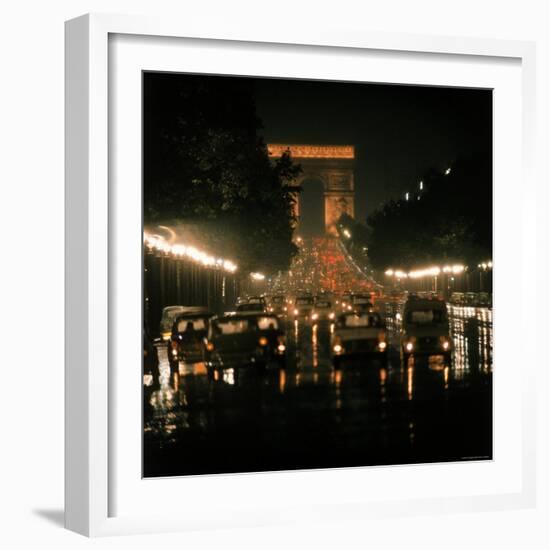 Night Time Traffic Streaming Down the Champs Elysees with the Arc de Triomphe in Background-Ralph Crane-Framed Photographic Print