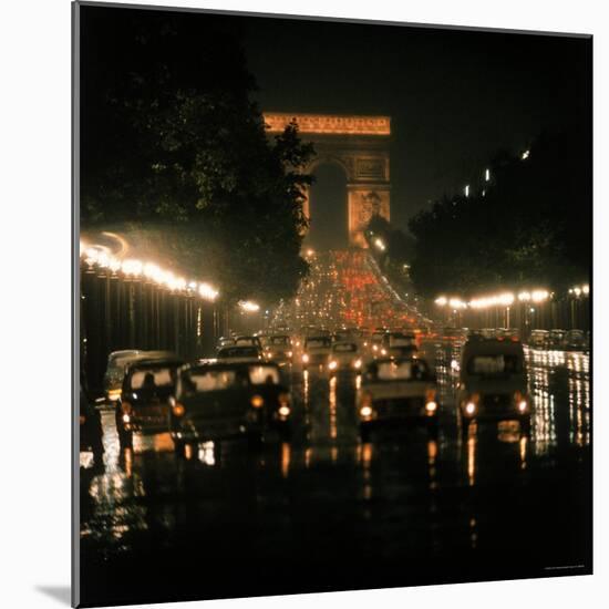 Night Time Traffic Streaming Down the Champs Elysees with the Arc de Triomphe in Background-Ralph Crane-Mounted Photographic Print