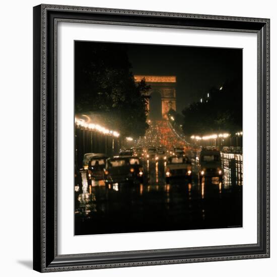 Night Time Traffic Streaming Down the Champs Elysees with the Arc de Triomphe in Background-Ralph Crane-Framed Photographic Print