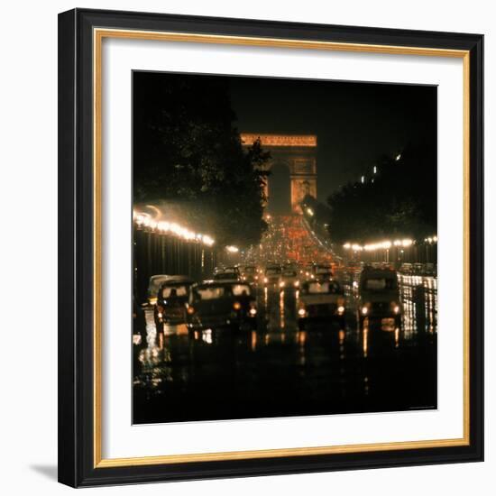 Night Time Traffic Streaming Down the Champs Elysees with the Arc de Triomphe in Background-Ralph Crane-Framed Photographic Print