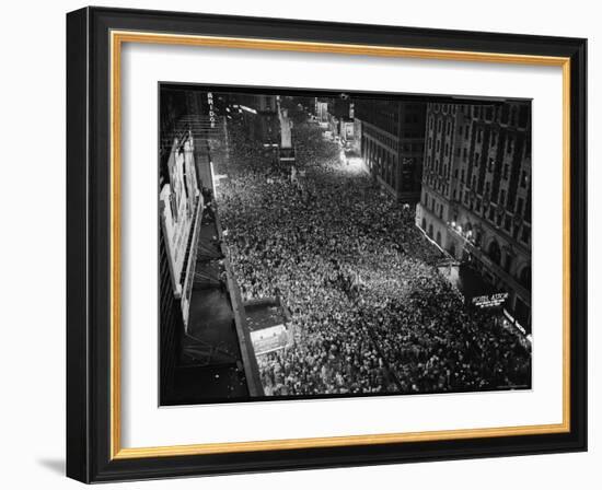 Night View of People Jammed into Times Square Celebrating the End of the War in Europe-Herbert Gehr-Framed Photographic Print