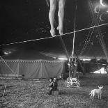 Two Small Children Watching Circus Performer Practicing on Tightrope, Her Legs Only Visible-Nina Leen-Photographic Print