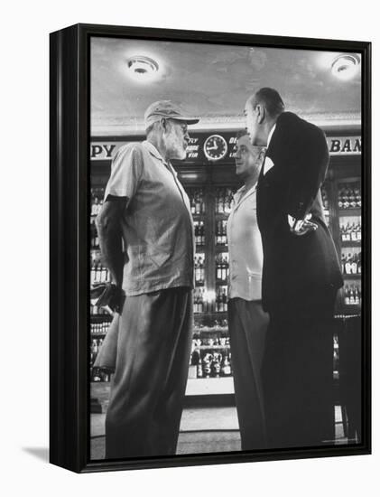 Noel Coward Chatting with Ernest Hemingway and Alec Guinness on Set Location at Sloppy Joe's Bar-Peter Stackpole-Framed Premier Image Canvas