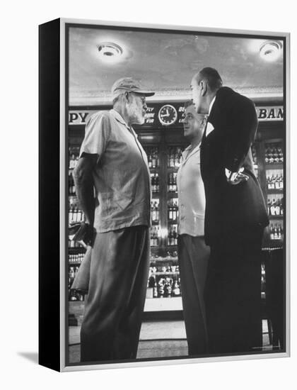 Noel Coward Chatting with Ernest Hemingway and Alec Guinness on Set Location at Sloppy Joe's Bar-Peter Stackpole-Framed Premier Image Canvas