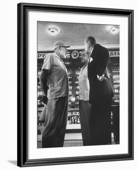 Noel Coward Chatting with Ernest Hemingway and Alec Guinness on Set Location at Sloppy Joe's Bar-Peter Stackpole-Framed Premium Photographic Print