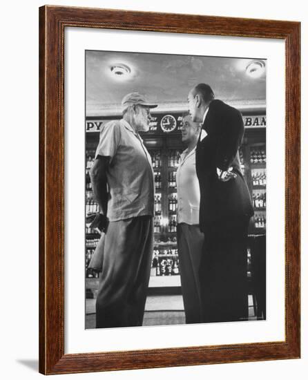 Noel Coward Chatting with Ernest Hemingway and Alec Guinness on Set Location at Sloppy Joe's Bar-Peter Stackpole-Framed Premium Photographic Print