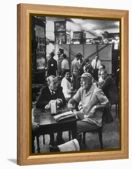 Noel Coward Chatting with Ernest Hemingway at Sloppy Joe's Bar-Peter Stackpole-Framed Premier Image Canvas