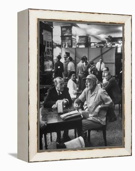 Noel Coward Chatting with Ernest Hemingway at Sloppy Joe's Bar-Peter Stackpole-Framed Premier Image Canvas