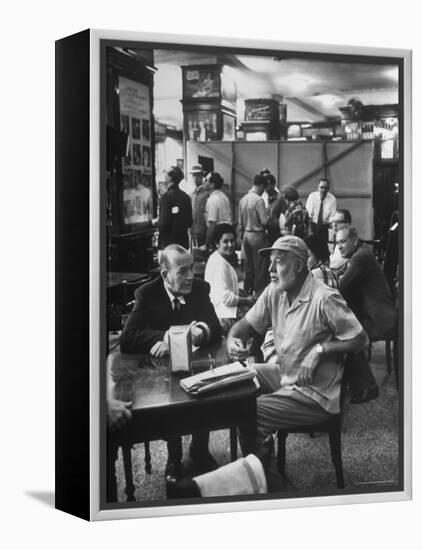 Noel Coward Chatting with Ernest Hemingway at Sloppy Joe's Bar-Peter Stackpole-Framed Premier Image Canvas