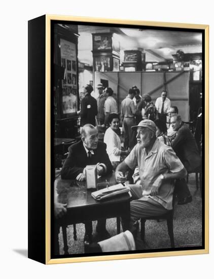 Noel Coward Chatting with Ernest Hemingway at Sloppy Joe's Bar-Peter Stackpole-Framed Premier Image Canvas