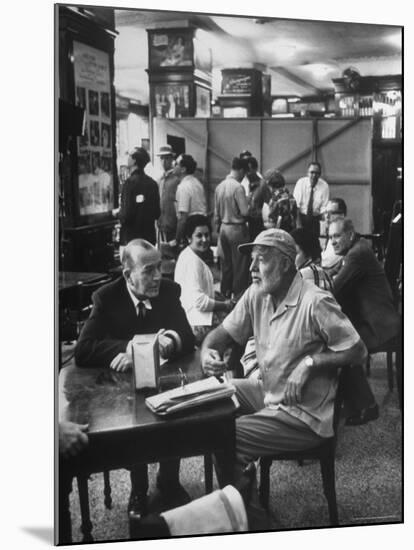 Noel Coward Chatting with Ernest Hemingway at Sloppy Joe's Bar-Peter Stackpole-Mounted Premium Photographic Print