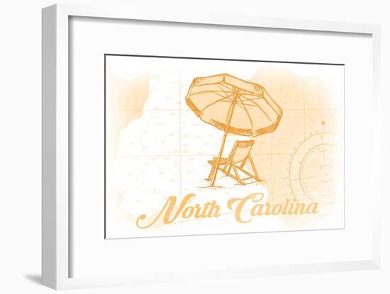 North Carolina - Beach Chair and Umbrella - Yellow - Coastal Icon-Lantern Press-Framed Art Print