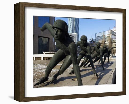 Northeast China, Heilongjiang Province, Harbin, A Statue of Female Ice Speed Skaters, China-Christian Kober-Framed Photographic Print