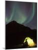 Northern Lights and Camper Outside Tent, Brooks Range, Arctic National Wildlife Refuge, Alaska, USA-Steve Kazlowski-Mounted Photographic Print