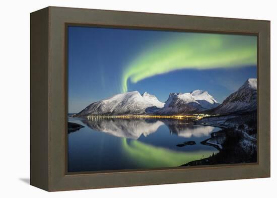 Northern lights and stars light up the snowy peaks reflected in sea, Bergsbotn, Senja, Norway-Roberto Moiola-Framed Premier Image Canvas